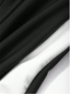 Detalle del diseño deportivo y combinación blanco y negro del vestido de baño de manga larga