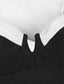 Detalle del vestido de baño negro y blanco con escote en V